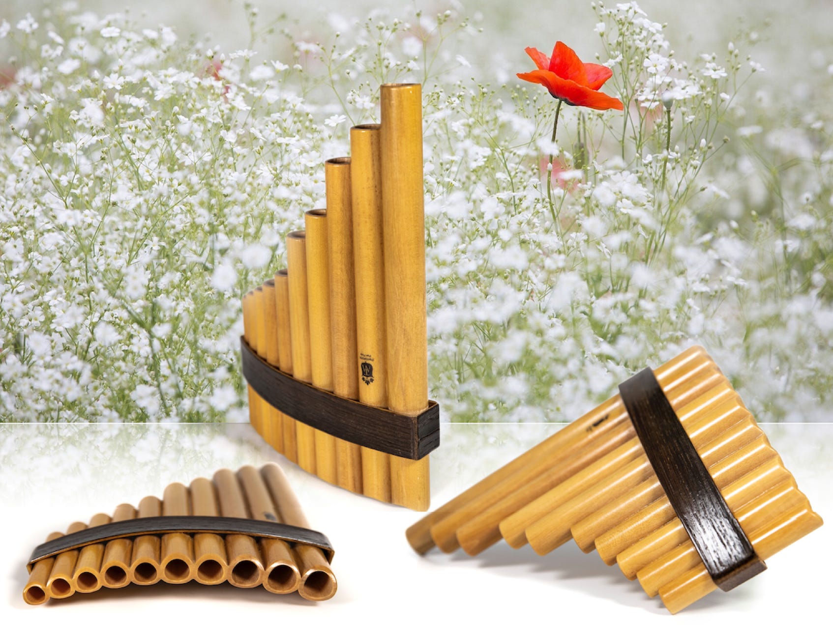 1 Pipe Fun Pipe Pan Flute with flowers in the background.